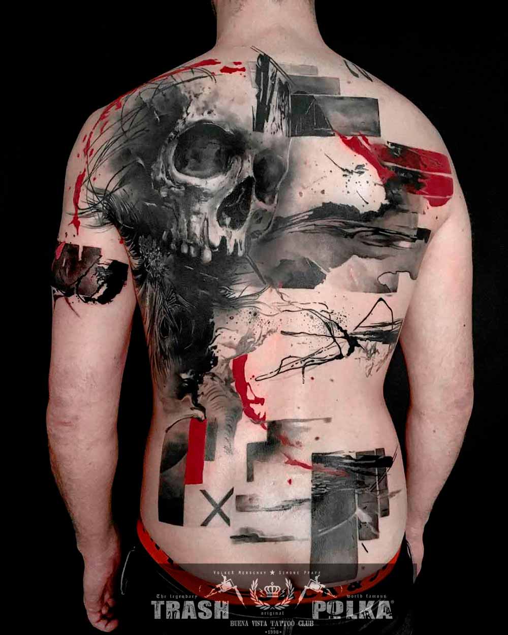 a complete back tattoo in trash polka style a skull with feathers a memento mori pic
