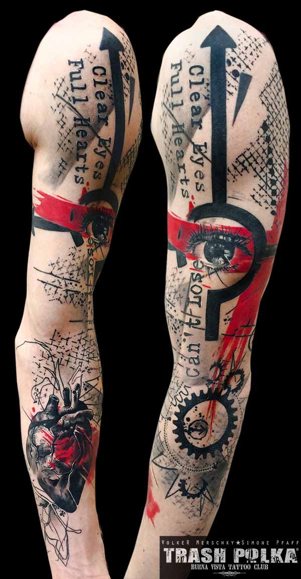 trash polka arm tattoo with human heart and graphic elements and a human eye
