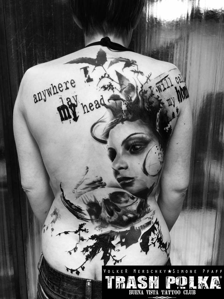 trash polka tattoo woman back tattoo a girls face holding a skull leaves and writing