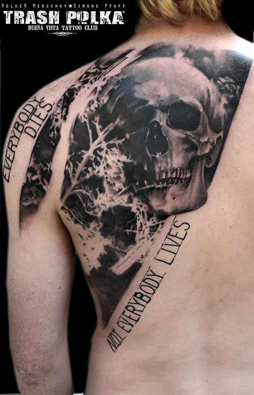 trash polka tattoo diagonally arranged skull tattoo as disc optics with writing