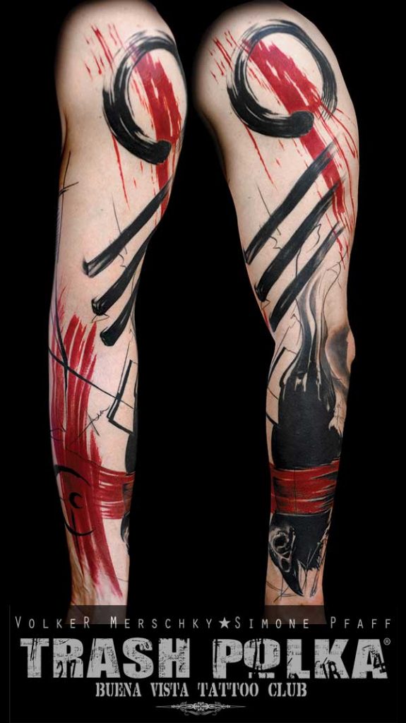 trash polka tattoo on a man arm very graphic forearm a raven with a skull head upper arm 3 stripes and a circle of life and red cross and stripe