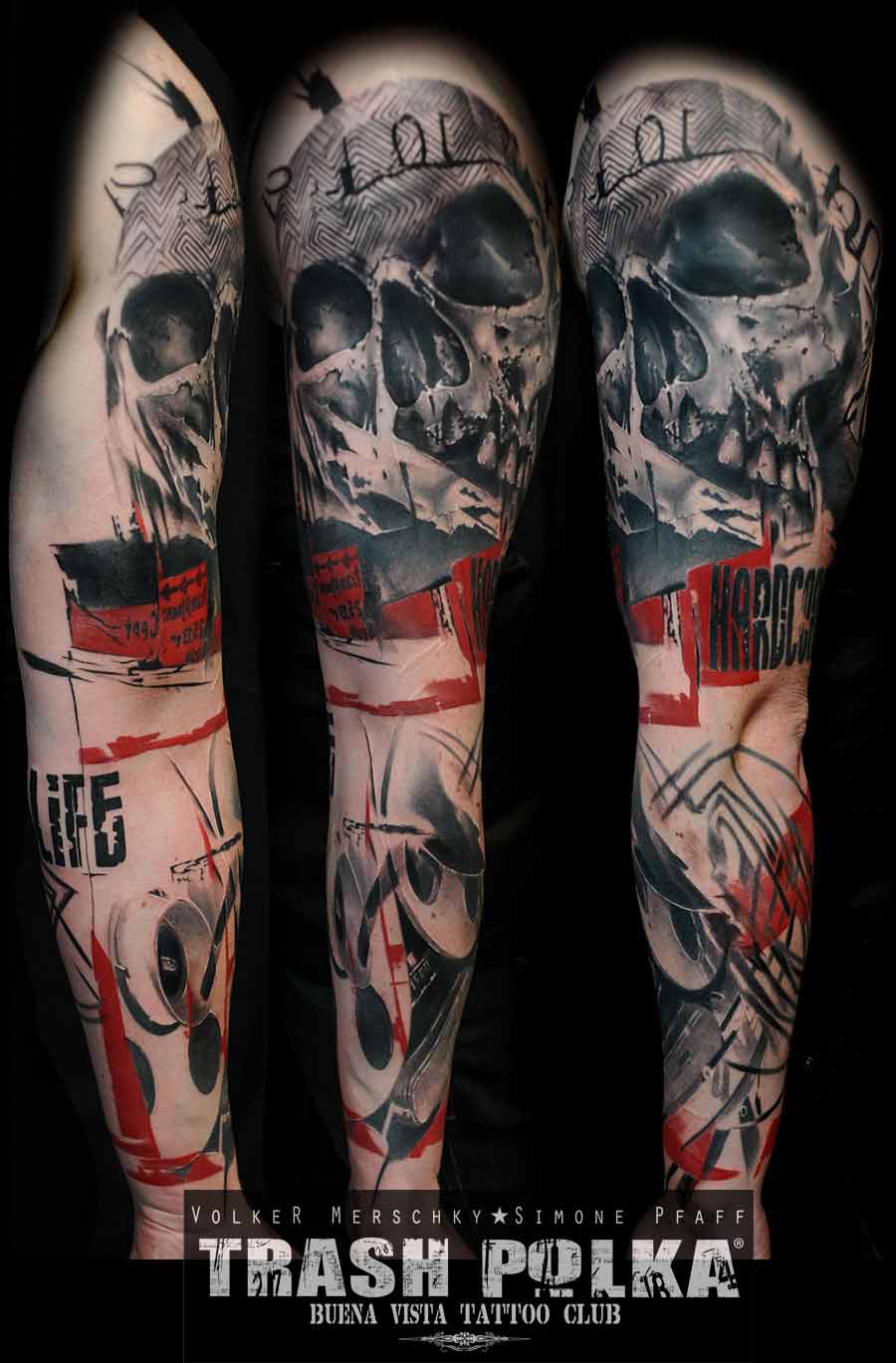 A trash polka arm tattoo shows a tape with a skull in red and black