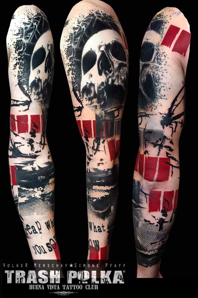 A trash polka arm tattoo shows on the arm a skull with dot work and red graphic designs