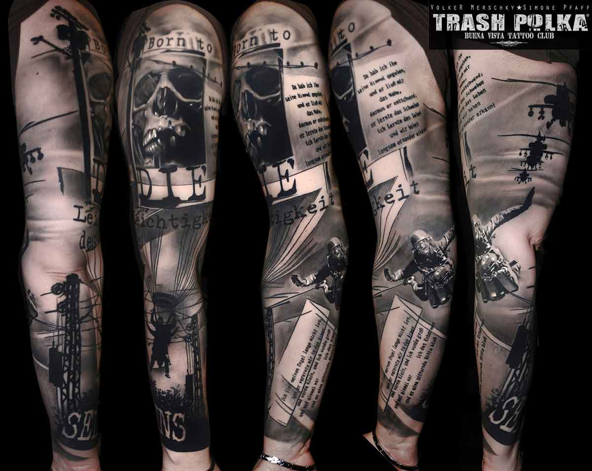 trash polka tattoo born to die on the upper arm turn into a falling skydiver
