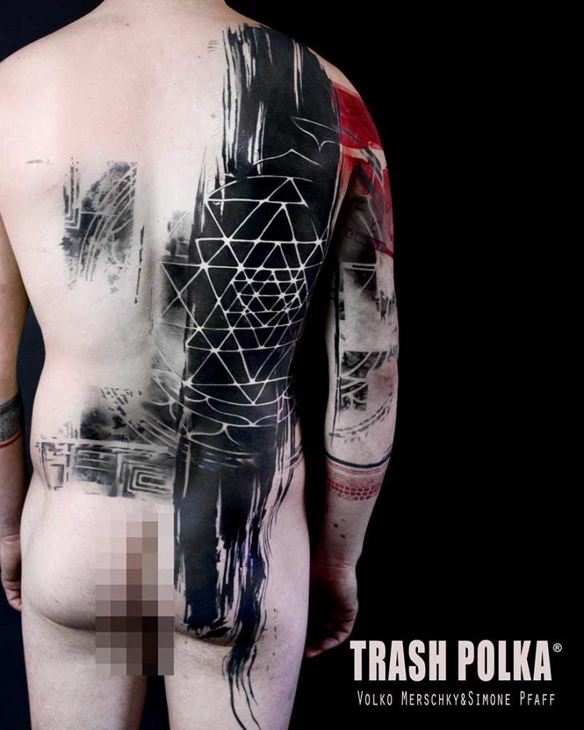 trash polka back tattoo shows futuristic triangles space freedom belieft
