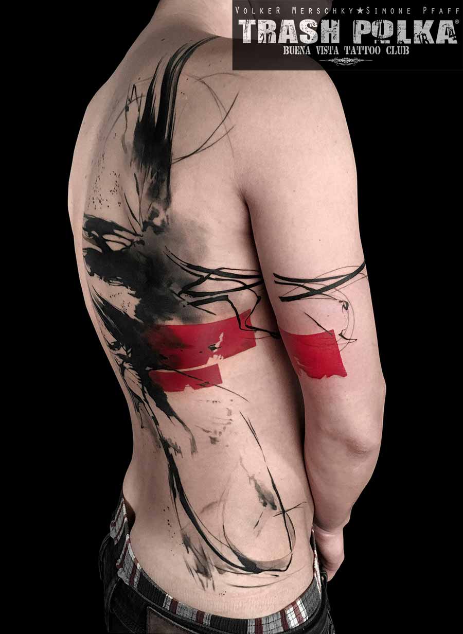 a graphic trash polka tattoo with red and black ink and lines wild and grey shadings