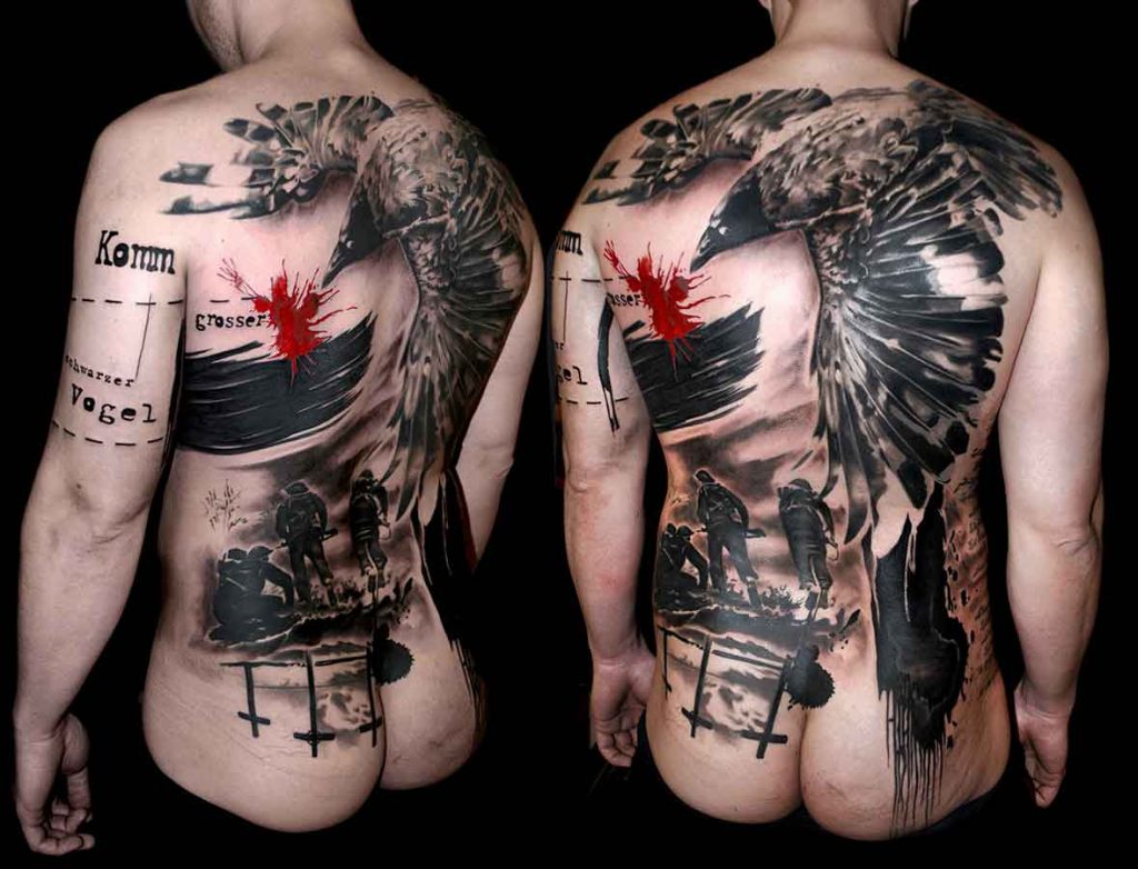 Trash polka tattoo on a mans back featuring a WW2 war scene and a large black bird hovering above it all