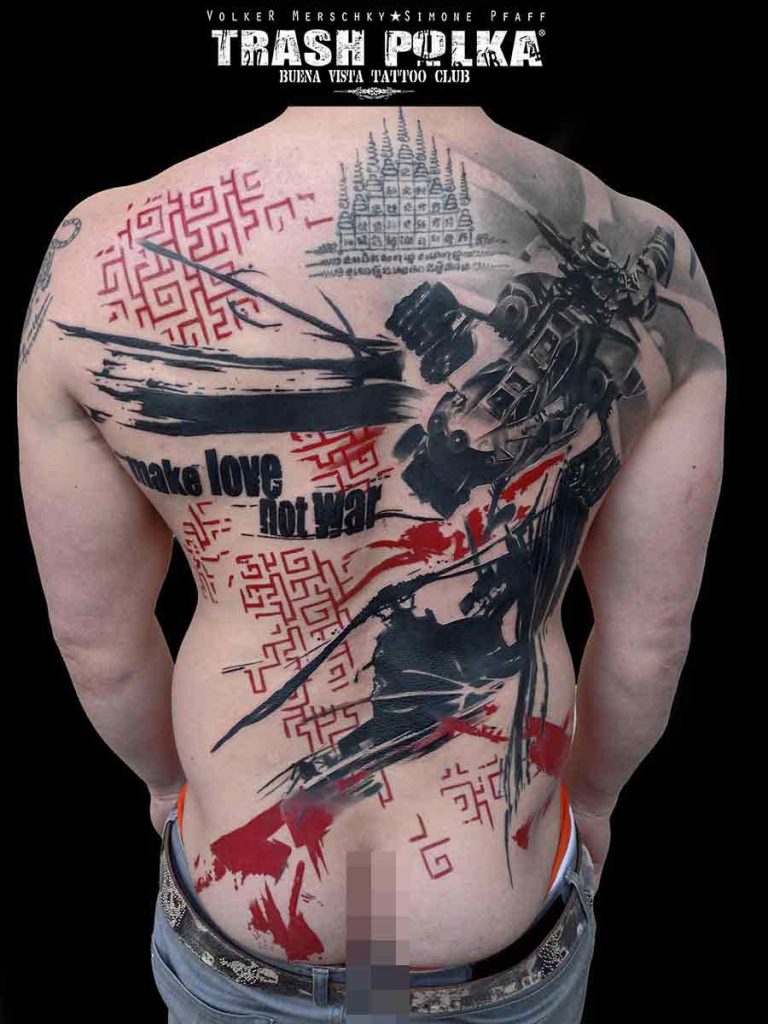 Trash polka helicopter tattoo on shoulder blade with large make Love not war lettering and asian luck patterns in red
