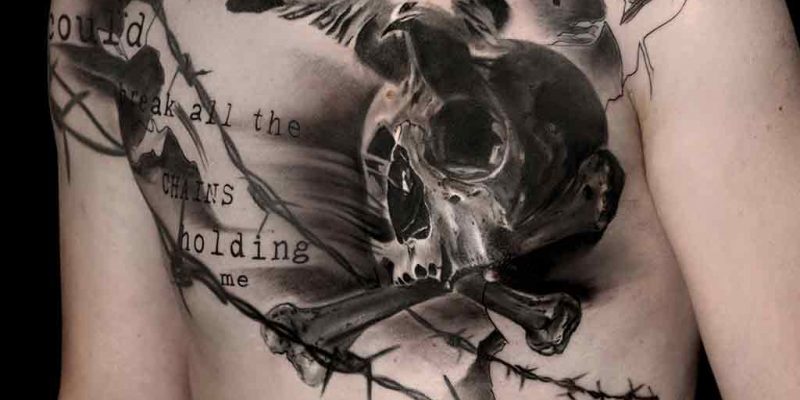 trash polka tattoo on the chest barbed wire encloses a skull from which the soul escapes in the form of a dove